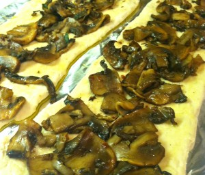 step 4 mushrooms spread on pizza